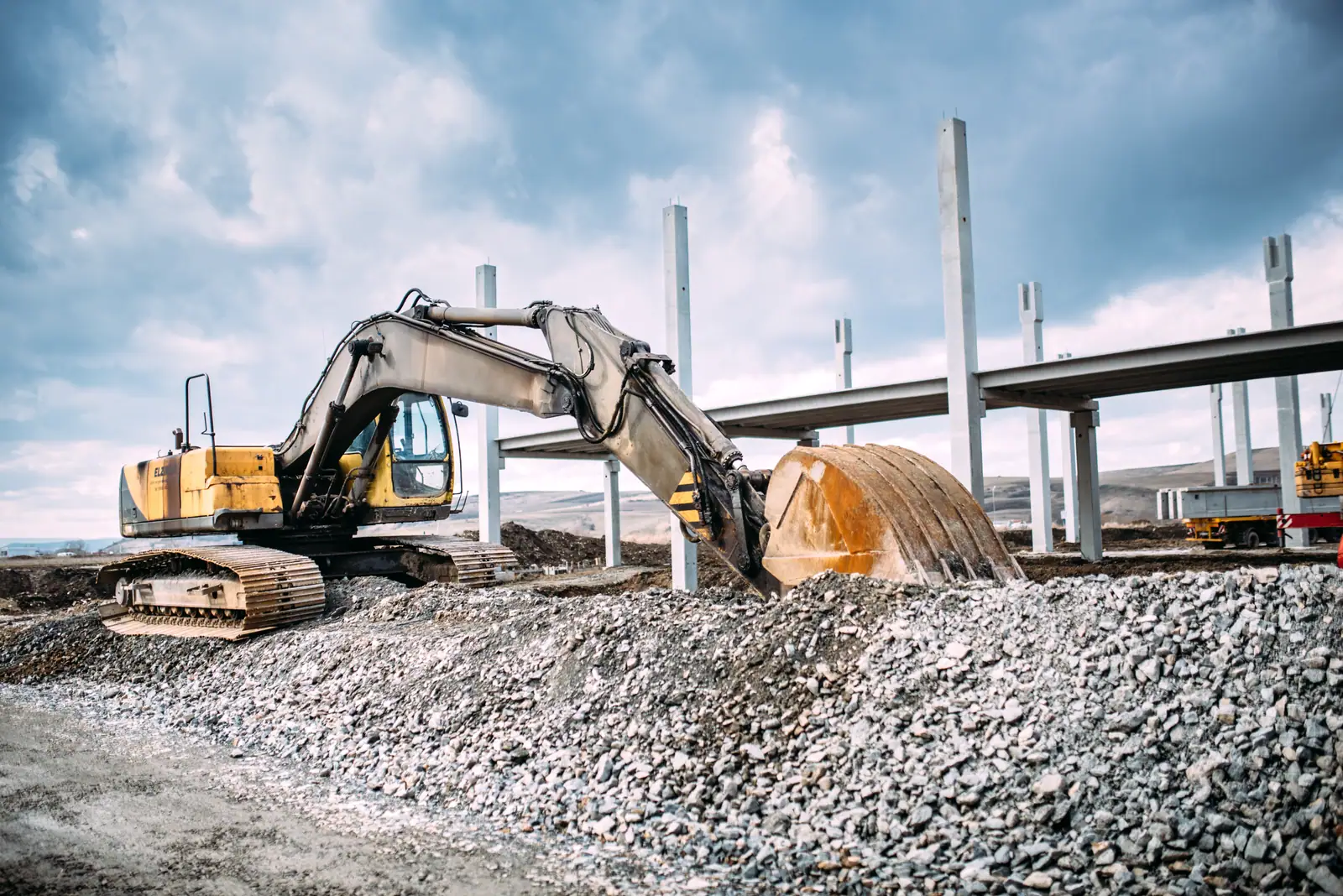 Excavator working a civils project at scale in Ghana